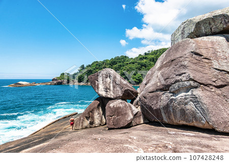Beach Caxadaco with stones and transparent sea at island Ilha Grande, Rio de Janeiro, Brazil 107428248