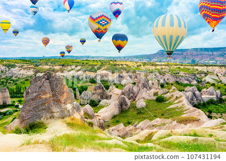 Fly of air balloons in Unique natural place - Cappadocia , Turkiye. Fly of air balloons in Unique natural place - Cappadocia , Turkiye. 107431194
