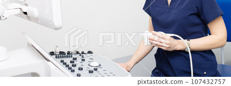 Female doctor sitting in office in a hospital doing ultrasound scanning diagnostic Female doctor sitting in office in a hospital doing ultrasound scanning diagnostic 107432757