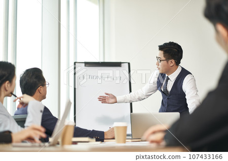 group of asian corporate executives meeting in office discussing business plans group of asian corporate executives meeting in office discussing business plans 107433166