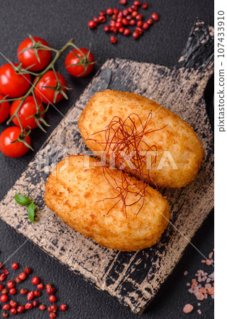 Delicious baked potato cutlet stuffed with chicken and vegetables, spices and salt 107433910
