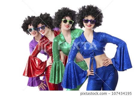 A group of girls in disco style and African wigs in colorful costumes on a white background. A group of girls in disco style and African wigs in colorful costumes on a white background. 107434195