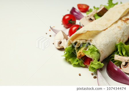 Tasty fast or homemade food concept - delicious shawarma Tasty fast or homemade food concept - delicious shawarma 107434474