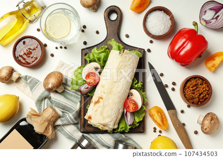 Tasty fast or homemade food concept - delicious shawarma Tasty fast or homemade food concept - delicious shawarma 107434503