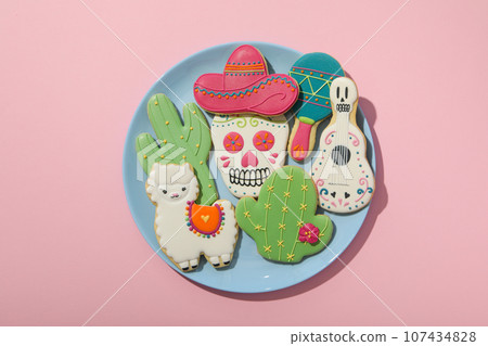 Mexican symbols in the form of gingerbread on a plate. 107434828