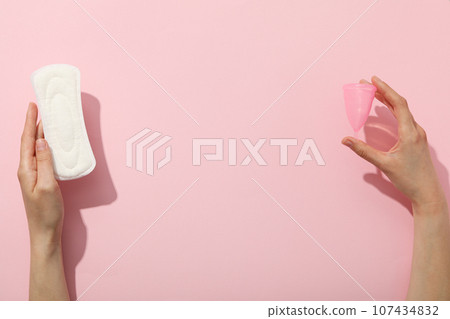 Hygiene products during the monthly cycle, with hands in the frame 107434832