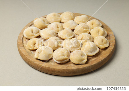 Cooking home food concept with raw dumplings Cooking home food concept with raw dumplings 107434833