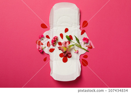 Menstrual pad with flowers on a pink background 107434834