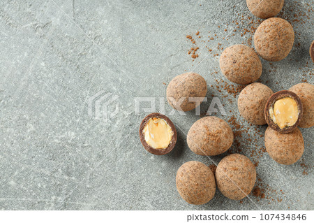 Tasty and sweet food - almonds in chocolate 107434846