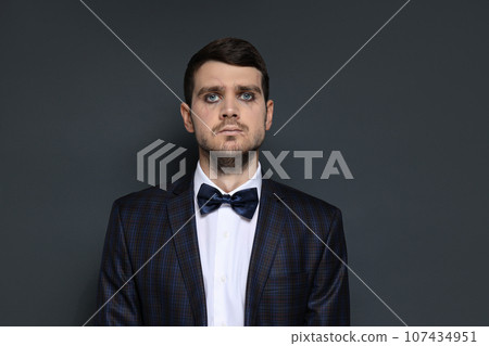 A man in a zombie costume on a black background A man in a zombie costume on a black background 107434951