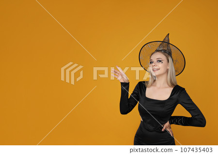 Girl in Halloween costume, with space for text Girl in Halloween costume, with space for text 107435403