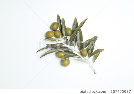 Olives and olive tree leaves on white background, top view Olives and olive tree leaves on white background, top view 107435987