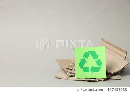 Sign of recycling of kraft cardboard, environmental protection. Smart use of resources. Sign of recycling of kraft cardboard, environmental protection. Smart use of resources. 107435988
