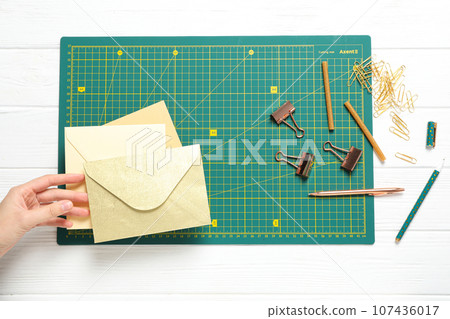 Patchwork accessories concept on white background, cutting mat 107436017