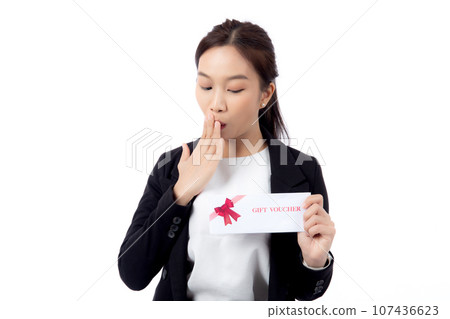Portrait happiness beautiful young asian businesswoman showing and present gift voucher. 107436623