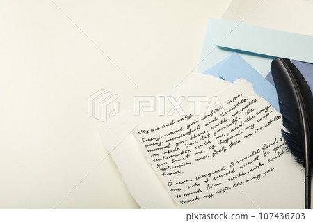 Paper, letter with text and bird feather on white background, space for text Paper, letter with text and bird feather on white background, space for text 107436703