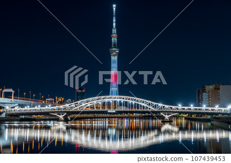 Tokyo Skytree seen from Shioiri Park in Tokyo, special illumination in the image of the Japanese flag 107439453