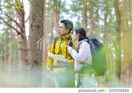 men and women hiking 107439848