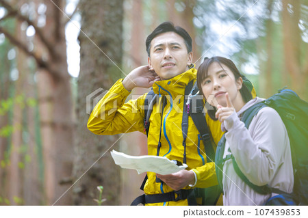 men and women hiking 107439853