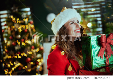 happy business owner woman in green office with Christmas tree 107440062