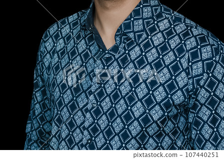 Men's abstract clothing style business fashion rhombus shirt blue pattern on dark background, close up 107440251