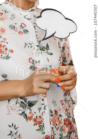 A woman in a white dress with a pattern of flowers holds in her hands with a manicure, an empty space for thoughts and design blank A woman in a white dress with a pattern of flowers holds in her hands with a manicure, an empty space for thoughts and design blank 107440307