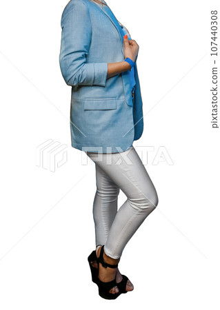 Slender girl in blue jacket, white pants and black sandals posing on isolated background, fashion style clothes Slender girl in blue jacket, white pants and black sandals posing on isolated background, fashion style clothes 107440308