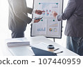 Finance and investment concept, Businessman present business finance investment plan with his partner, Investor colleagues discussing new investment plan by financial graph data on office table with 107440959