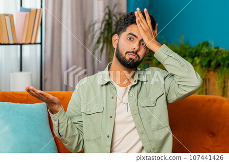 Upset sad Indian man making face palm gesture, feeling bored, disappointed in fail bad results news Upset sad Indian man making face palm gesture, feeling bored, disappointed in fail bad results news 107441426