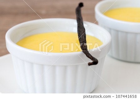 Homemade vanilla custard on wooden table background 107441658