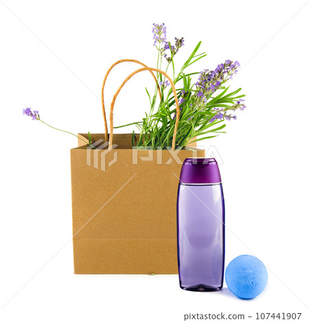 Lavender shampoo (shower gel) and a bouquet of lavender flowers in a paper bag isolated on a white . Collage. 107441907