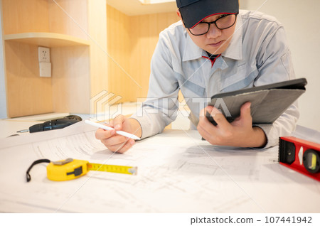 Asian male Interior worker working with construction tools 107441942