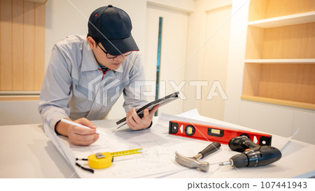 Asian male Interior worker working with construction tools Asian male Interior worker working with construction tools 107441943