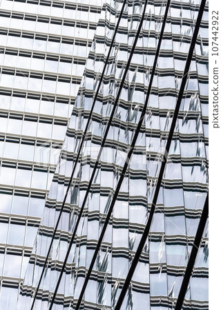 Abstract view of glass curtain wall in modern office buildings with reflection Abstract view of glass curtain wall in modern office buildings with reflection 107442922