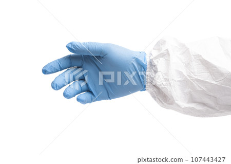 doctor's hand in blue surgical medical gloves and white coverall suit 107443427