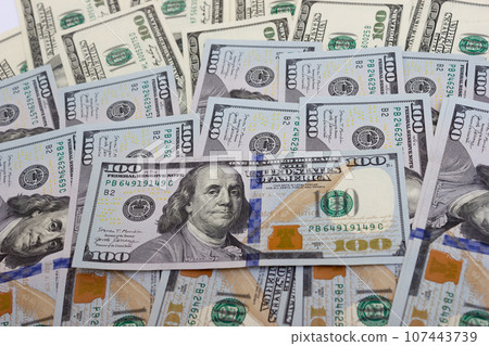 Bundle of dollars on the table close-up - texture, background 107443739