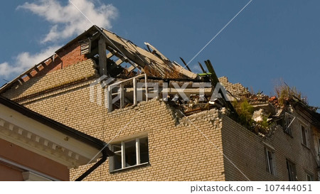 A house destroyed after shelling in a Ukrainian city. The house has no roof and no part of the exterior walls. War 107444051