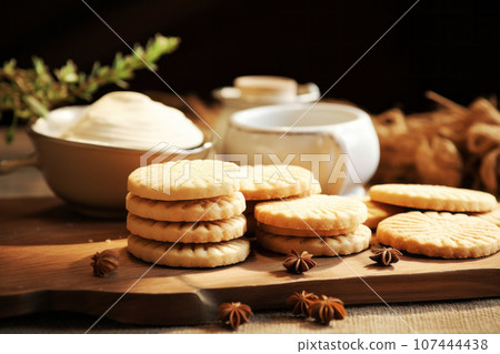 Vanilla biscuit cookie dessert for tea coffee milk closeup shot on wooden background. Generative AI Vanilla biscuit cookie dessert for tea coffee milk closeup shot on wooden background. Generative AI 107444438