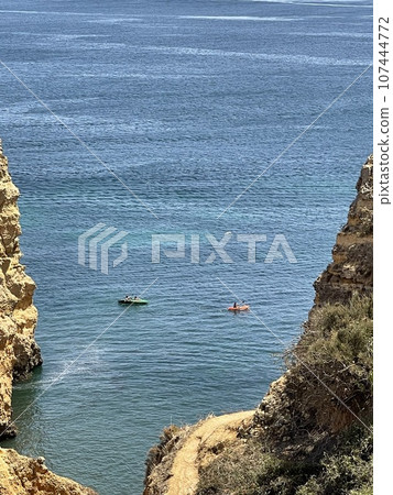 Rocks and sandy beach in Portugal, Lagos 107444772