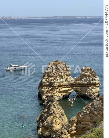 Rocks and sandy beach in Portugal, Lagos 107444775