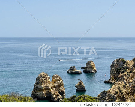 Rocks and sandy beach in Portugal, Lagos 107444783