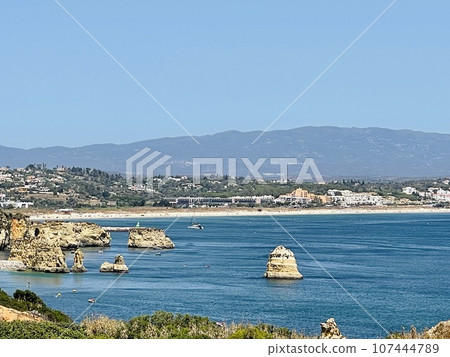 Rocks and sandy beach in Portugal, Lagos Rocks and sandy beach in Portugal, Lagos 107444789