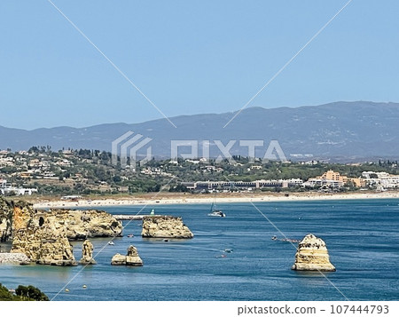 Rocks and sandy beach in Portugal, Lagos Rocks and sandy beach in Portugal, Lagos 107444793