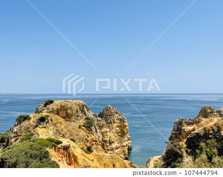 Rocks and sandy beach in Portugal, Lagos 107444794