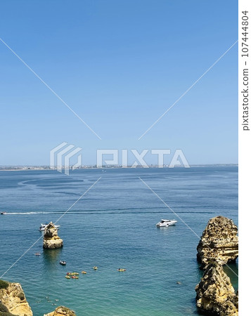 Rocks and sandy beach in Portugal, Lagos Rocks and sandy beach in Portugal, Lagos 107444804