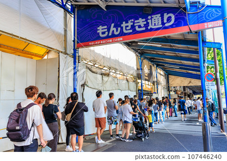 Chuo Ward, Tokyo Tsukiji Outer Market (Monzeki Street) crowded with tourists 107446240