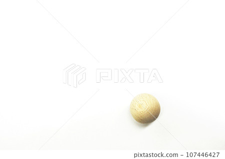 One wooden sphere with visible wood grain One wooden sphere with visible wood grain 107446427