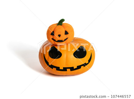 Halloween pumpkin with little wool pumpkin. Jack pumpkin head isolated on a white background. Halloween pumpkin with little wool pumpkin. Jack pumpkin head isolated on a white background. 107446557