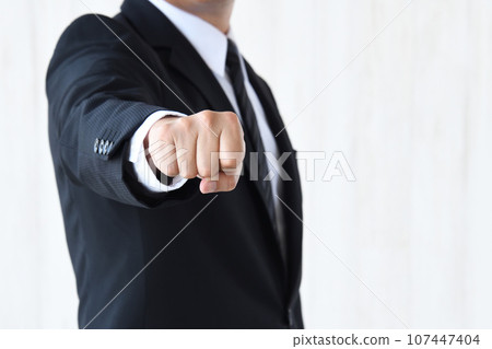  Businessman sticking out fist 107447404