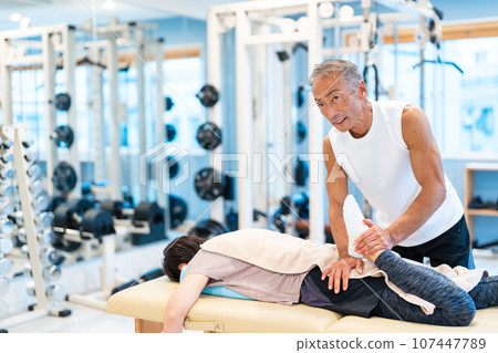 Sports massage gym stretching 107447789